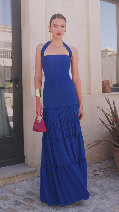 Falda larga Samira en gasa azul marino con volantes canasteros y corte bajo. Elegante y con movimiento. Ideal para eventos. Confeccionada en España.